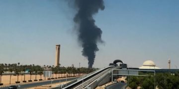 A plume of dark smoke rises behind the terminal at King Khalid International Airport in Riyadh, Saudi Arabia. A plume of dark smoke rises behind the terminal at King Khalid International Airport in Riyadh, Saudi Arabia.