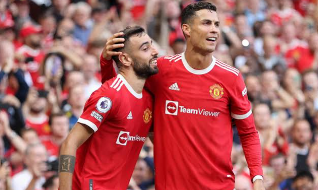 Manchester United midfielder Bruno Fernandes alongside Cristiano Ronaldo during a team match, as Fernandes backs the veteran forward amid uncertainty over his international future.