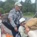 Four residents carrying personal belongings as they leave Oleshky in southern Ukraine.(photo credit Ksenia Arkhipova BBC)